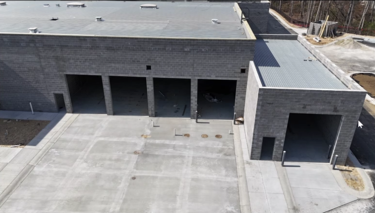 Close-up of the newly constructed service bay entrances at Mercedes-Benz of Buford..png